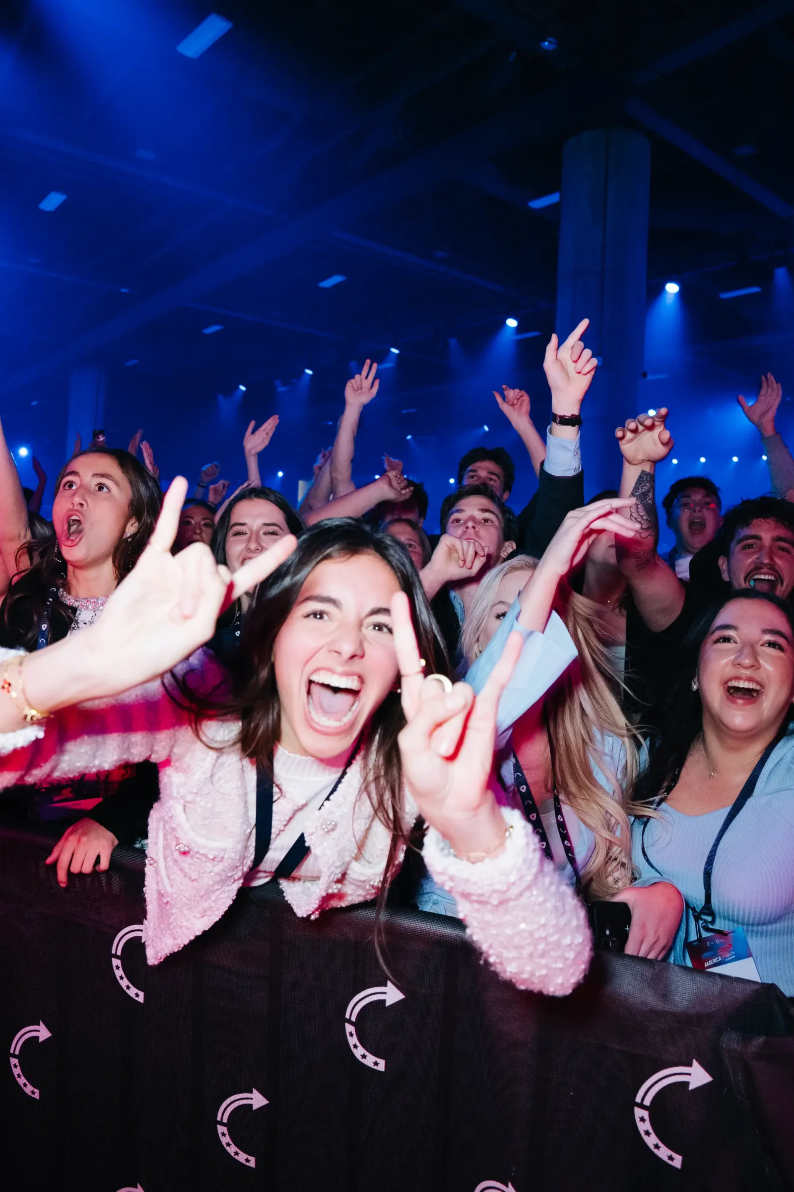 AmericaFest attendees cheering during the live program